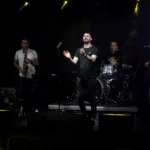 Pure Genius band performing live with saxophone, vocals and drums